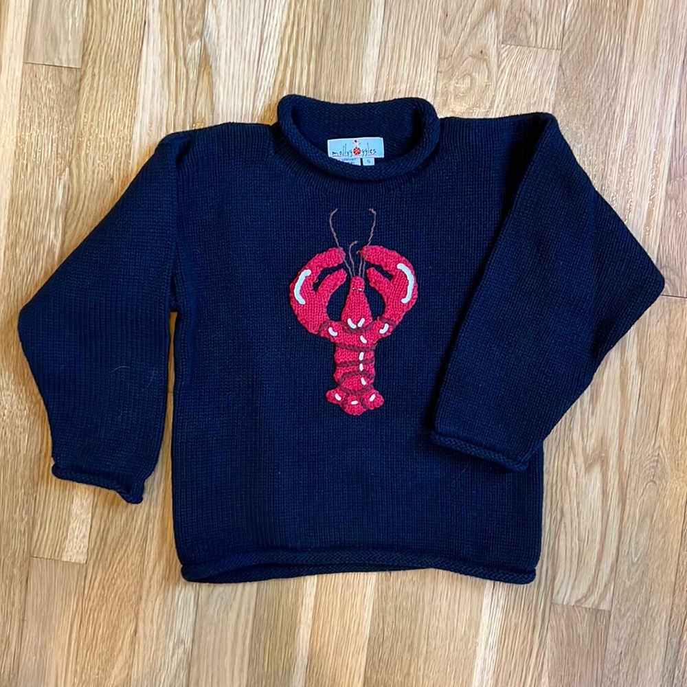Adorable handknit navy cotton sweater with roll neck.